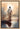 Gabriel Heaton painting of Jesus Christ seen from behind walking into brilliant white light reflected in calm water surrounded by dramatic clouds