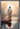Gabriel Heaton painting of Jesus Christ seen from behind walking into brilliant white light reflected in calm water surrounded by dramatic clouds