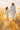 Gabriel Heaton painting of Jesus Christ in white robes walking through a golden wheat field with two young girls following closely behind him