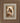 Gabriel Heaton painting of the Virgin Mary in white robes with a soft halo tenderly holding the newborn baby Jesus swaddled in white cloth