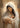 Gabriel Heaton painting of the Virgin Mary in white robes with a soft halo tenderly holding the newborn baby Jesus swaddled in white cloth