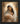 Gabriel Heaton painting of the Virgin Mary in white robes with a soft halo tenderly holding the newborn baby Jesus swaddled in white cloth