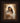 Gabriel Heaton painting of the Virgin Mary in white robes with a soft halo tenderly holding the newborn baby Jesus swaddled in white cloth