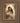 Gabriel Heaton painting of the Virgin Mary in white robes with a soft halo tenderly holding the newborn baby Jesus swaddled in white cloth