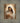 Gabriel Heaton painting of the Virgin Mary in white robes with a soft halo tenderly holding the newborn baby Jesus swaddled in white cloth