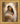 Gabriel Heaton painting of the Virgin Mary in white robes with a soft halo tenderly holding the newborn baby Jesus swaddled in white cloth