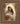 Gabriel Heaton painting of the Virgin Mary in white robes with a soft halo tenderly holding the newborn baby Jesus swaddled in white cloth