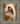 Gabriel Heaton painting of the Virgin Mary in white robes with a soft halo tenderly holding the newborn baby Jesus swaddled in white cloth