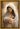 Gabriel Heaton painting of the Virgin Mary in white robes with a soft halo tenderly holding the newborn baby Jesus swaddled in white cloth
