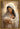 Gabriel Heaton painting of the Virgin Mary in white robes with a soft halo tenderly holding the newborn baby Jesus swaddled in white cloth