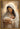 Gabriel Heaton painting of the Virgin Mary in white robes with a soft halo tenderly holding the newborn baby Jesus swaddled in white cloth