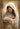 Gabriel Heaton painting of the Virgin Mary in white robes with a soft halo tenderly holding the newborn baby Jesus swaddled in white cloth