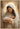 Gabriel Heaton painting of the Virgin Mary in white robes with a soft halo tenderly holding the newborn baby Jesus swaddled in white cloth