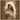 Gabriel Heaton painting of the Virgin Mary in white robes with a soft halo tenderly holding the newborn baby Jesus swaddled in white cloth