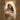 Gabriel Heaton painting of the Virgin Mary in white robes with a soft halo tenderly holding the newborn baby Jesus swaddled in white cloth