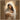 Gabriel Heaton painting of the Virgin Mary in white robes with a soft halo tenderly holding the newborn baby Jesus swaddled in white cloth