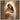 Gabriel Heaton painting of the Virgin Mary in white robes with a soft halo tenderly holding the newborn baby Jesus swaddled in white cloth