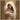 Gabriel Heaton painting of the Virgin Mary in white robes with a soft halo tenderly holding the newborn baby Jesus swaddled in white cloth