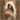 Gabriel Heaton painting of the Virgin Mary in white robes with a soft halo tenderly holding the newborn baby Jesus swaddled in white cloth