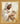 Gabriel Heaton painting of Jesus Christ in white robes tenderly holding a small white lamb close to his chest with a gentle loving expression