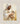 Gabriel Heaton painting of Jesus Christ in white robes tenderly holding a small white lamb close to his chest with a gentle loving expression
