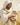 Gabriel Heaton painting of Jesus Christ in white robes tenderly holding a small white lamb close to his chest with a gentle loving expression