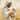 Gabriel Heaton painting of Jesus Christ in white robes tenderly holding a small white lamb close to his chest with a gentle loving expression