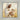 Gabriel Heaton painting of Jesus Christ in white robes tenderly holding a small white lamb close to his chest with a gentle loving expression