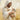 Gabriel Heaton painting of Jesus Christ in white robes tenderly holding a small white lamb close to his chest with a gentle loving expression