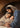 Gabriel Heaton painting of Joseph and Mary cradling the newborn baby Jesus in a warm, intimate nativity scene