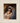 Gabriel Heaton painting of Joseph and Mary cradling the newborn baby Jesus in a warm, intimate nativity scene