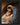 Gabriel Heaton painting of Joseph and Mary cradling the newborn baby Jesus in a warm, intimate nativity scene