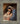 Gabriel Heaton painting of Joseph and Mary cradling the newborn baby Jesus in a warm, intimate nativity scene