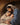 Gabriel Heaton painting of Joseph and Mary cradling the newborn baby Jesus in a warm, intimate nativity scene