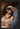 Gabriel Heaton painting of Joseph and Mary cradling the newborn baby Jesus in a warm, intimate nativity scene