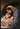 Gabriel Heaton painting of Joseph and Mary cradling the newborn baby Jesus in a warm, intimate nativity scene
