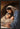 Gabriel Heaton painting of Joseph and Mary cradling the newborn baby Jesus in a warm, intimate nativity scene