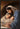 Gabriel Heaton painting of Joseph and Mary cradling the newborn baby Jesus in a warm, intimate nativity scene