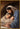 Gabriel Heaton painting of Joseph and Mary cradling the newborn baby Jesus in a warm, intimate nativity scene