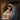 Gabriel Heaton painting of Joseph and Mary cradling the newborn baby Jesus in a warm, intimate nativity scene
