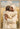 Gabriel Heaton painting of Jesus Christ in white robes giving a full embrace to a young man in a golden wheat field in a tender reunion
