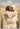 Gabriel Heaton painting of Jesus Christ in white robes giving a full embrace to a young man in a golden wheat field in a tender reunion