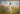 Gabriel Heaton painting of Jesus Christ in white robes walking through a vibrant wildflower meadow with pink and yellow blooms under a blue sky