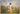 Gabriel Heaton painting of Jesus Christ in white robes walking through a vibrant wildflower meadow with pink and yellow blooms under a blue sky