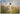 Gabriel Heaton painting of Jesus Christ in white robes walking through a vibrant wildflower meadow with pink and yellow blooms under a blue sky