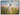 Gabriel Heaton painting of Jesus Christ in white robes walking through a vibrant wildflower meadow with pink and yellow blooms under a blue sky