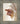 Gabriel Heaton painting of the outstretched nail-scarred hand of Jesus Christ in white robes reaching toward the viewer