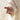 Gabriel Heaton painting of the outstretched nail-scarred hand of Jesus Christ in white robes reaching toward the viewer