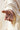 Gabriel Heaton painting of the outstretched nail-scarred hand of Jesus Christ in white robes reaching toward the viewer