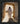 Gabriel Heaton painting of Jesus Christ in white robes standing in the doorway of the empty tomb looking out into bright light beyond the stone archway